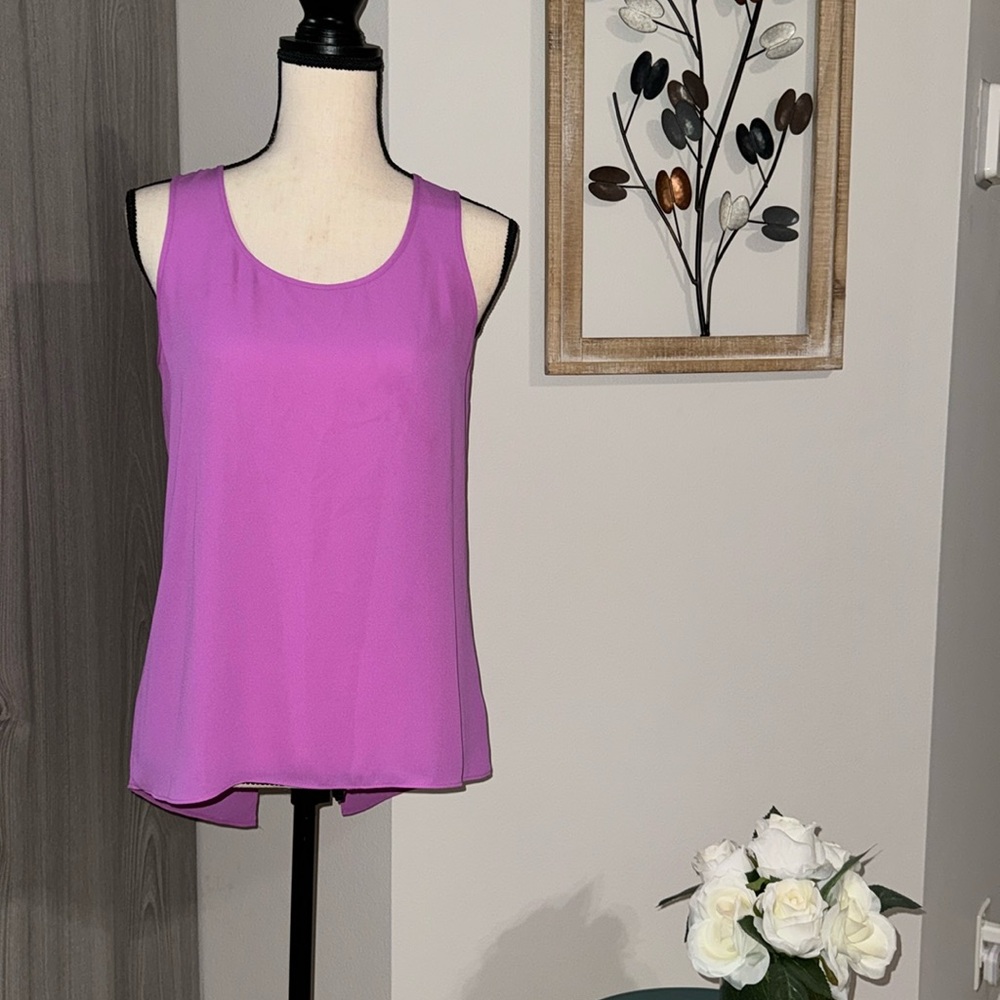Bright purple sleeveless top with open back.